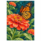 Finished diamond painting of a monarch butterfly resting on an orange zinnia, shown on a white background.