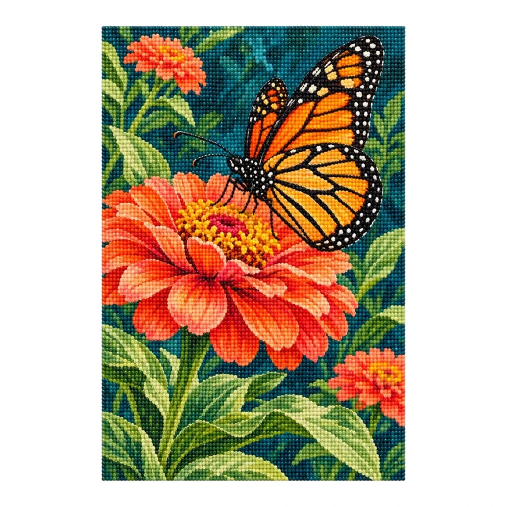 Finished diamond painting of a monarch butterfly resting on an orange zinnia, shown on a white background.