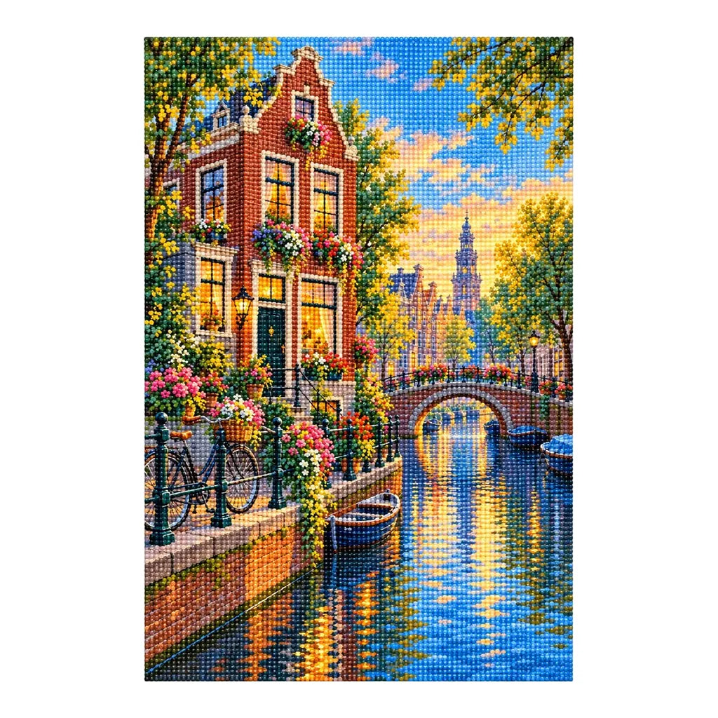 Finished white-background diamond painting of a canal house, bridge, and boats