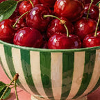 Close-up diamond detail of the cherries in a striped bowl diamond painting