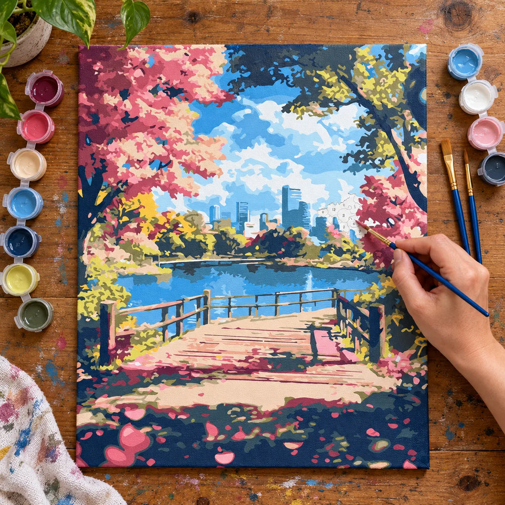 Complete Cherry Blossom City Park numbered canvas being painted with acrylic paints and brushes