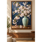Pale pink cherry blossoms arranged in a celadon vase against a deep blue background: displayed as home wall decor