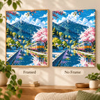 Framed and no-frame comparison for the Cherry Blossoms By The Tracks diamond painting, featuring pink cherry blossoms lining a mountain railway as a train crosses a blue stream.