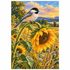 Finished chickadee and sunflower diamond painting on a white background