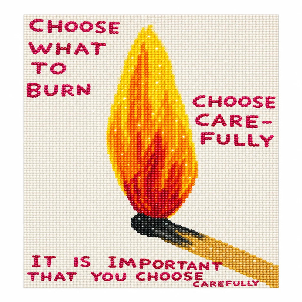 Finished diamond painting of a single upright flame beside the words “Choose What to Burn”.