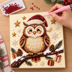 Pink dotting pen placing a pearl on the Christmas owl canvas