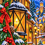 Close-up diamond drill detail of the glowing lantern and snowy village