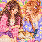 Close-up of faceted drills forming two college friends scrapbooking in a cozy dorm at night