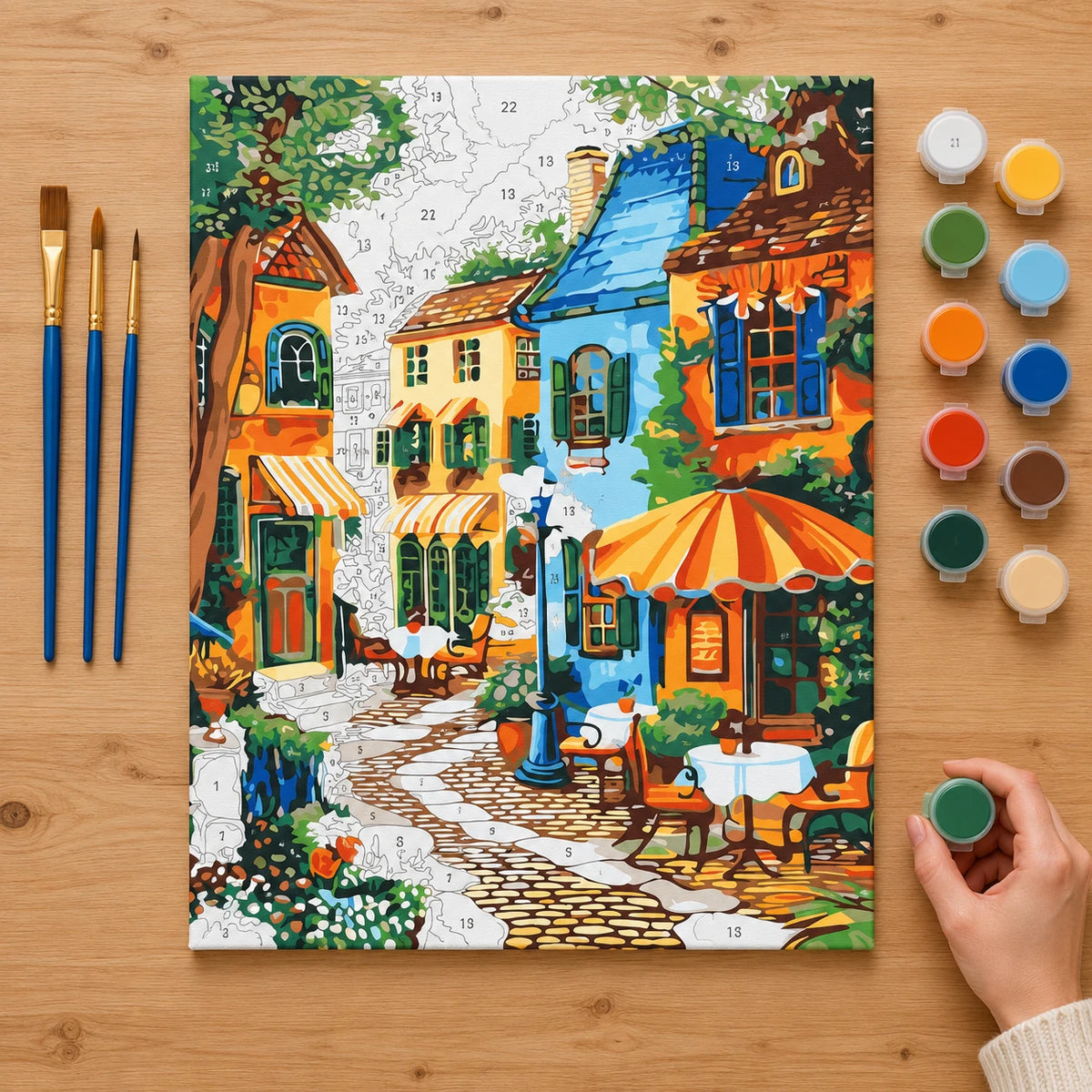 Complete Colorful Café Street numbered canvas being painted with acrylic paints and brushes