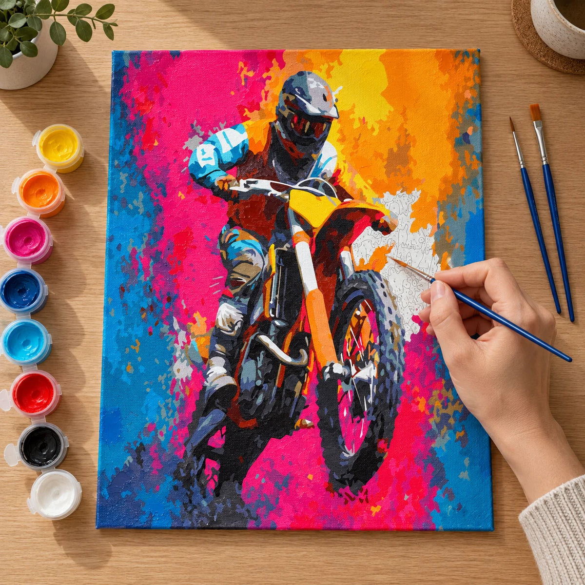 Complete Colorful Motocross Rider numbered canvas being painted with acrylic paints and brushes
