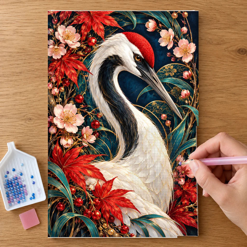 Hands placing drills on the Crane Maple Blossom Frame diamond painting canvas