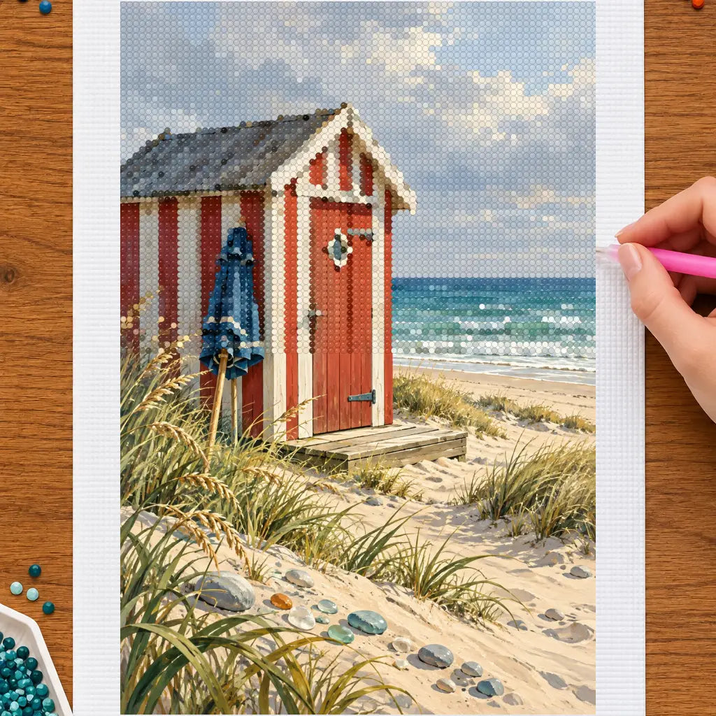 Hands placing drills on the danish beach hut with seaglass diamond painting canvas
