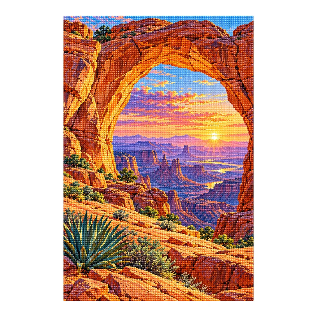 Finished diamond painting of a sandstone desert arch framing a colorful sunrise