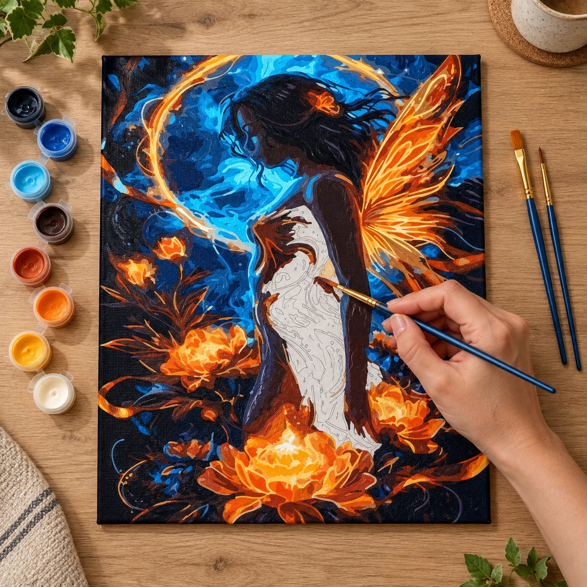 Complete Fire and Water Fairy with Golden Wings numbered canvas being painted with acrylic paints and brushes