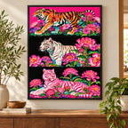 Framed home decor scene featuring a diamond painting of three tigers in pink and coral flowers across a triptych displayed on a wall.