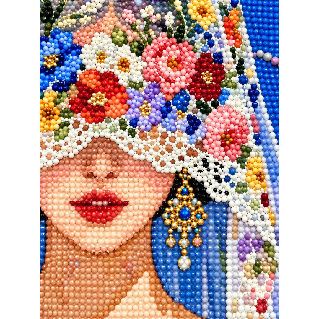 Close-up diamond drill detail of the bride’s flower-covered veil and face