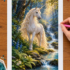 Hands placing drills on the forest unicorn by a stream diamond painting canvas