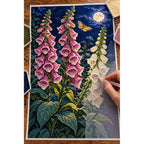 Pink and ivory foxgloves beneath a full moon with a golden moth: diamond painting in progress with a pen