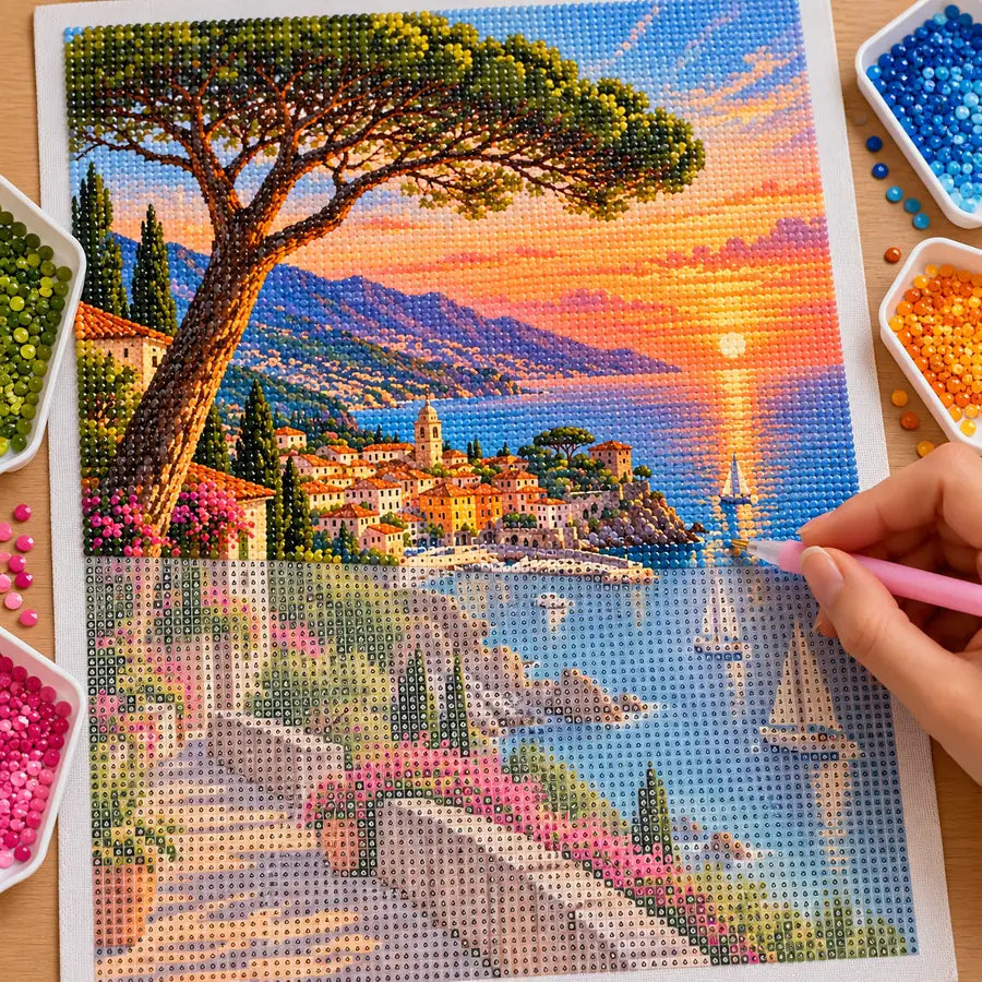 Hands placing diamond drills on the French Riviera Coast design.