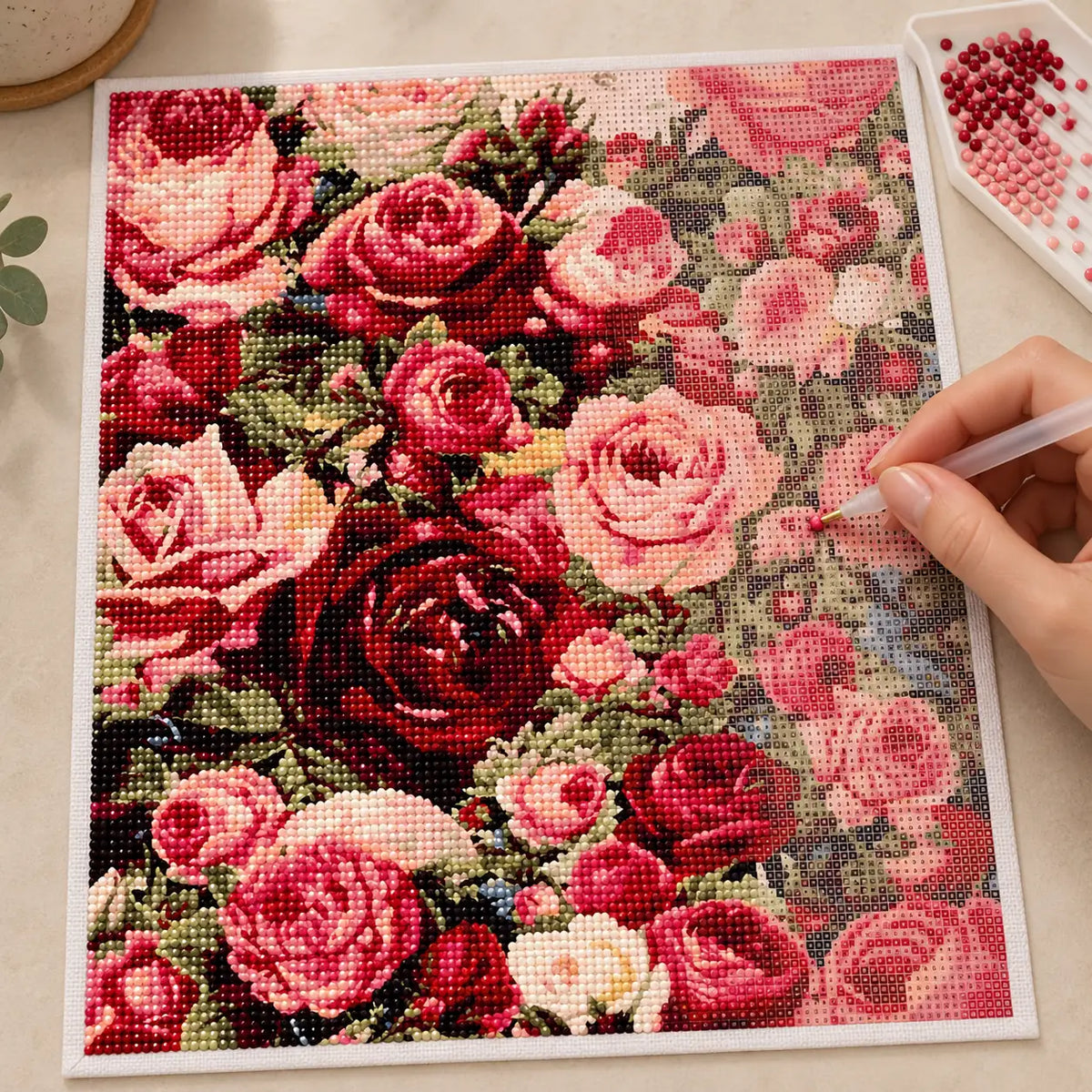 Diamond painting process for garden of blushing roses.