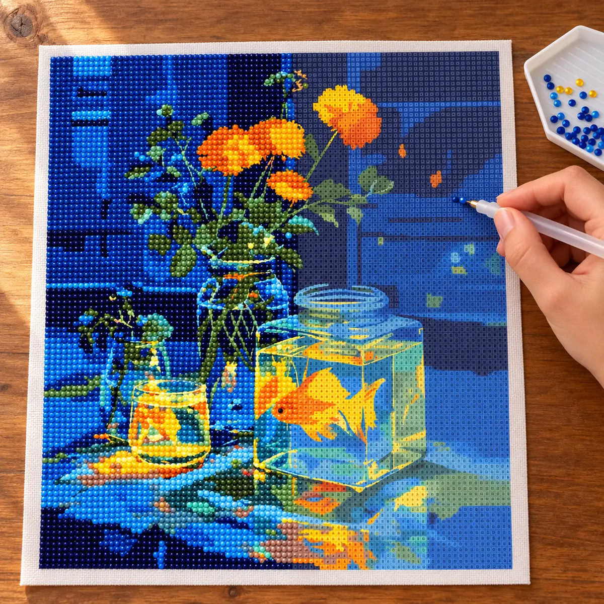 Diamond painting process for golden glow on blue.