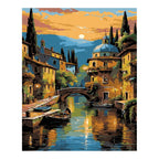 Original artwork for Golden Hour by the Canal Diamond Painting Kit, showing boats and old-town buildings reflected in a golden canal at sunset.