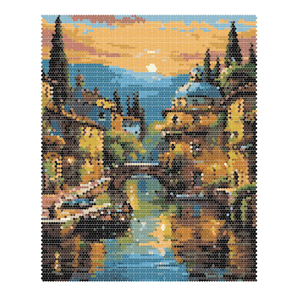 Finished diamond painting of boats and old-town buildings reflected in a golden canal at sunset.