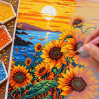 Diamond painting process for Golden Sunflower Glow, with drills being placed over sunflowers beside a lake beneath a glowing golden sunset.