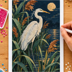 Hands placing drills on the heron among reeds diamond painting canvas
