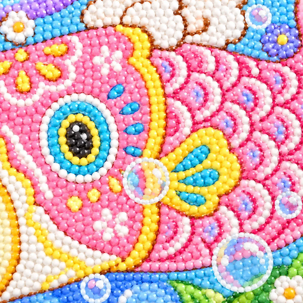 Close-up diamond drill detail of a colorful carp streamer and spring flowers