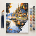 Complete Lakeside Cabin in Golden Light numbered canvas being painted with acrylic paints and brushes