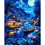 Finished diamond painting for Lakeside Moon Glow Diamond Painting Kit, showing a moonlit mountain village and boats reflected on a blue lake.