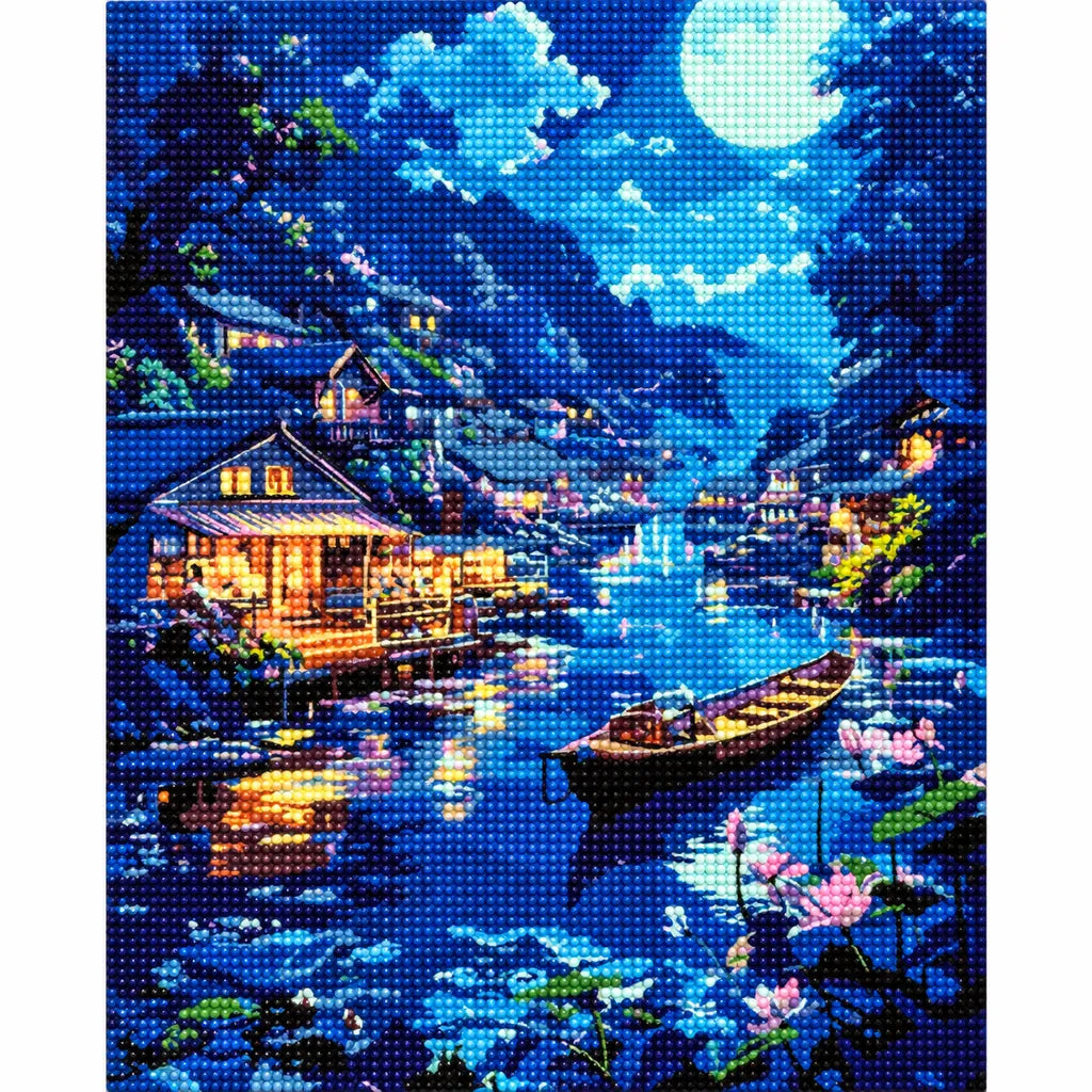 Finished diamond painting for Lakeside Moon Glow Diamond Painting Kit, showing a moonlit mountain village and boats reflected on a blue lake.