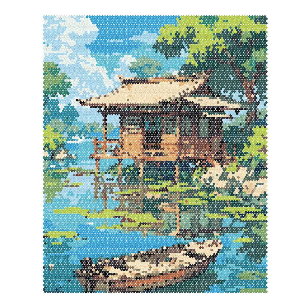 Finished diamond painting of a wooden cabin and rowboat beside a calm tree-lined lake.