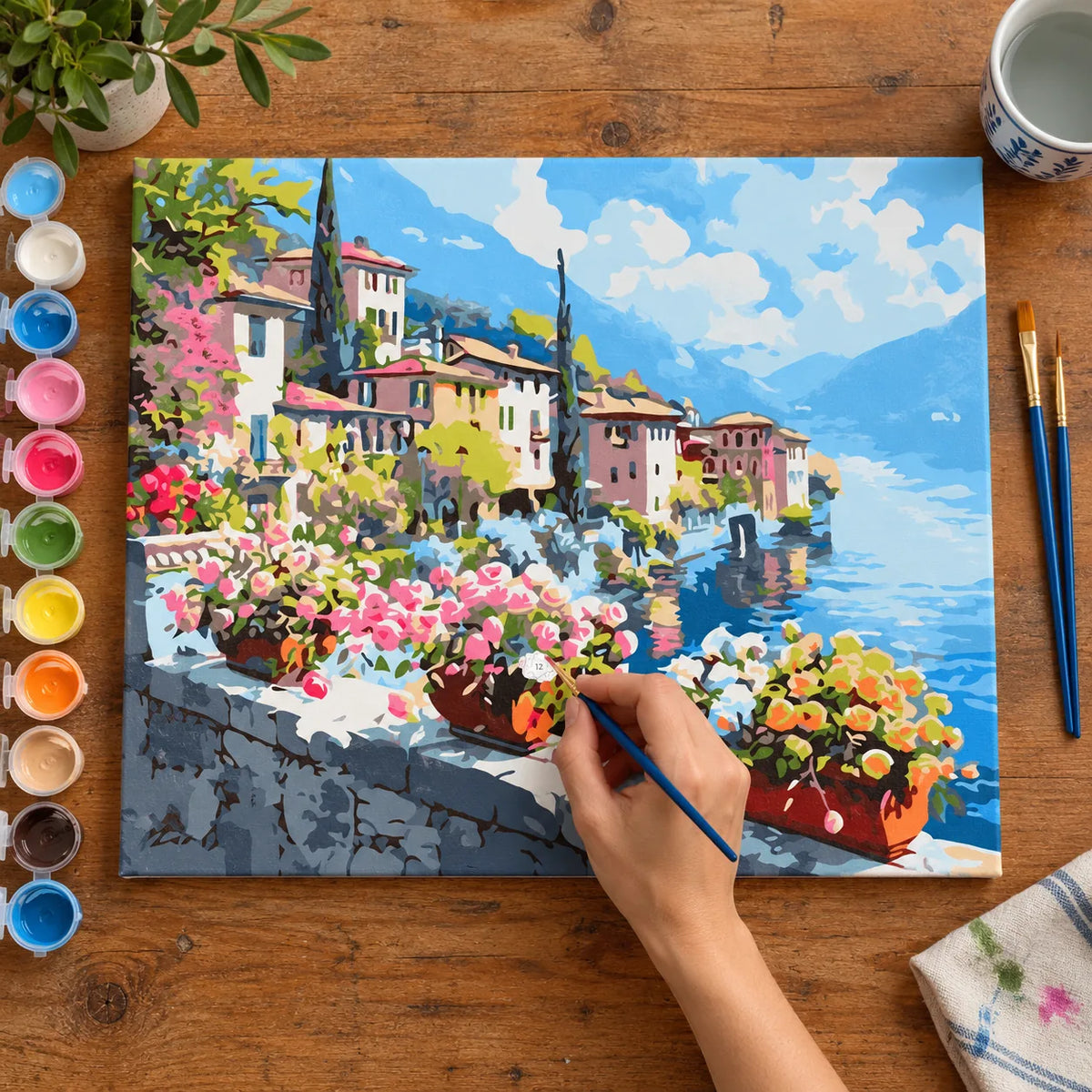 Complete Lakeside Village Flower Terrace numbered canvas being painted with acrylic paints and brushes