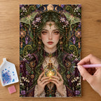 Hands placing drills on the Lantern Moth Alchemist diamond painting canvas