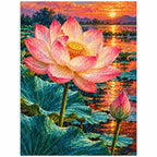 A large pink lotus and closed bud above teal leaves beside a glowing sunset pond: finished diamond painting on a clean white background
