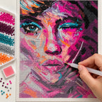 Hands placing drills on the magenta-violet abstract woman portrait diamond painting.