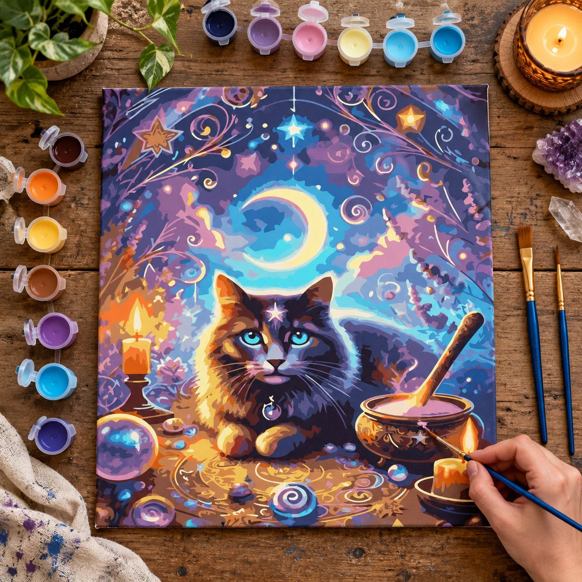 Complete Magical Black Cat with Moon and Cauldron numbered canvas being painted with acrylic paints and brushes