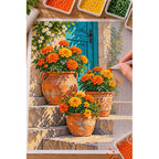 Marigolds by a Blue Cottage Door: diamond painting in progress