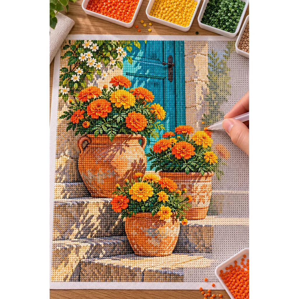 Marigolds by a Blue Cottage Door: diamond painting in progress