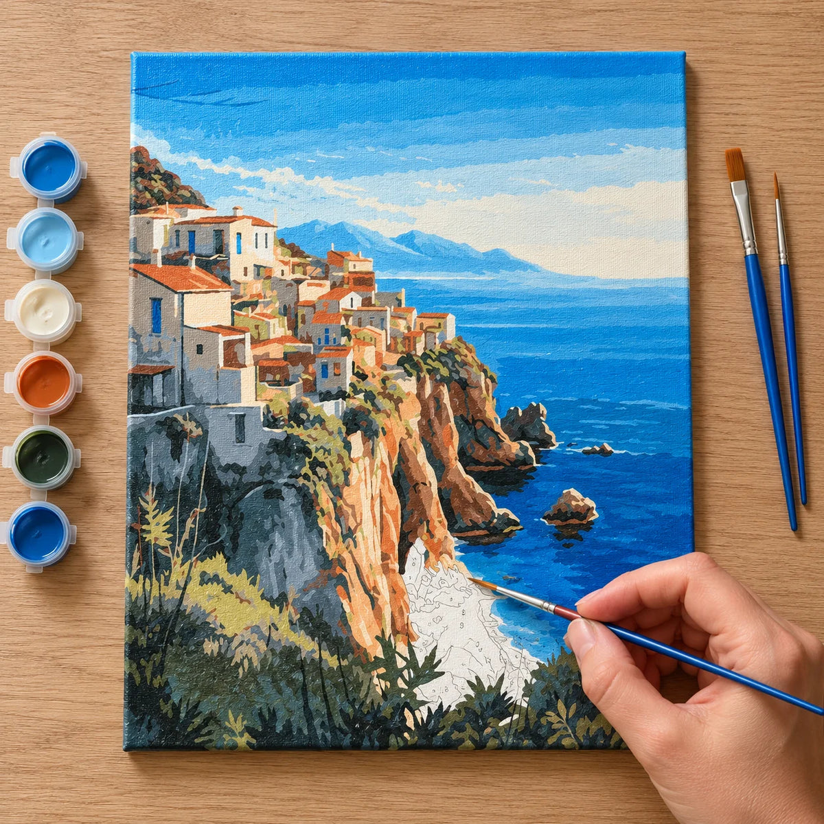 Complete Mediterranean Cliffside Village numbered canvas being painted with acrylic paints and brushes