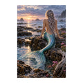 White-background original artwork of a mermaid sitting on rocks beside a sunset tide pool