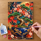 Hands placing drills on the Miniature Bonsai Jade Pot diamond painting canvas