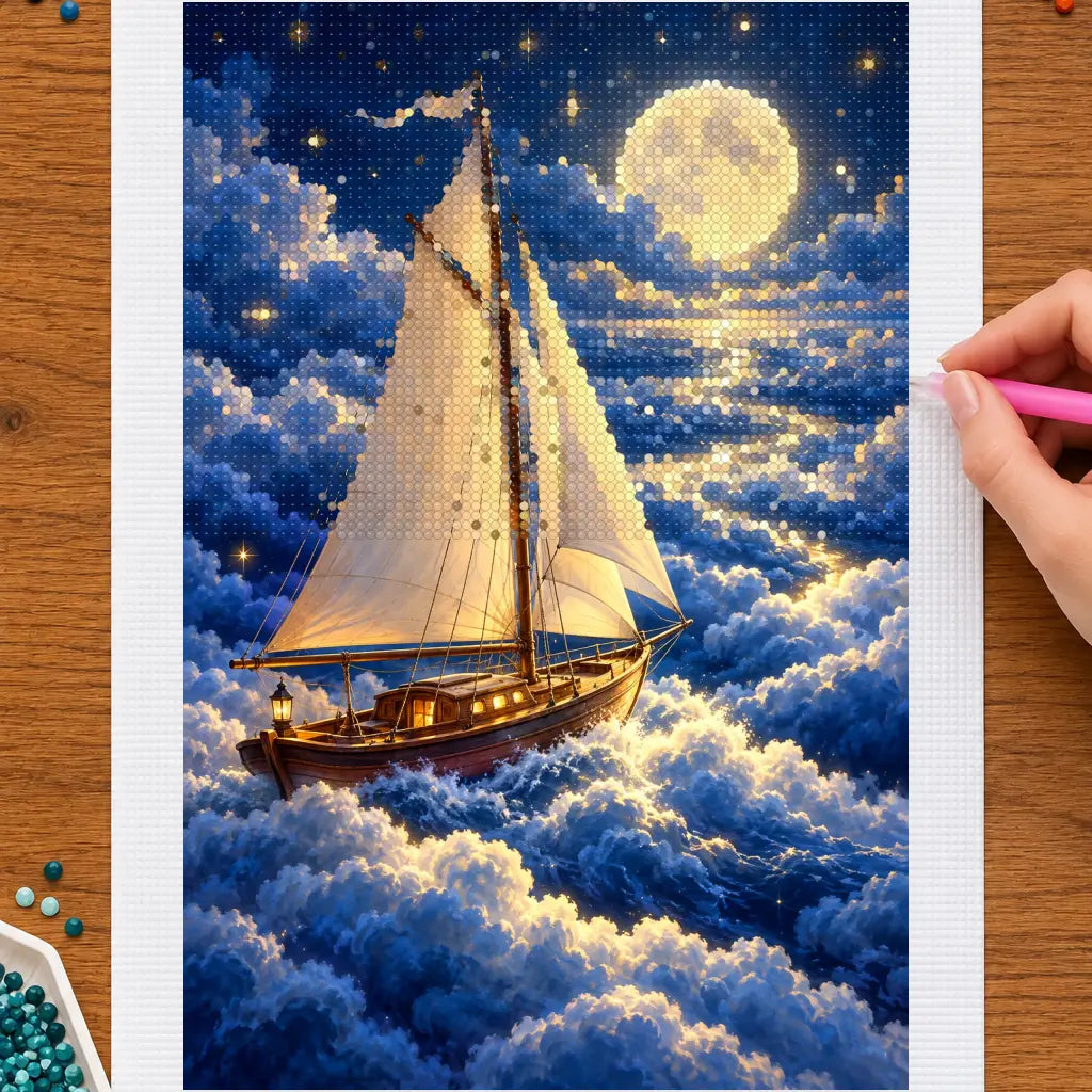 Hands placing drills on the moonlight sailing ship diamond painting canvas
