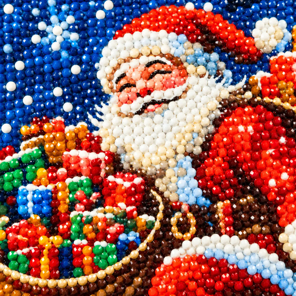 Close-up of diamond drill details in a moonlit Santa delivery scene.