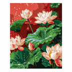 Finished diamond painting showing white lotus flowers and broad green leaves against a warm red backdrop.