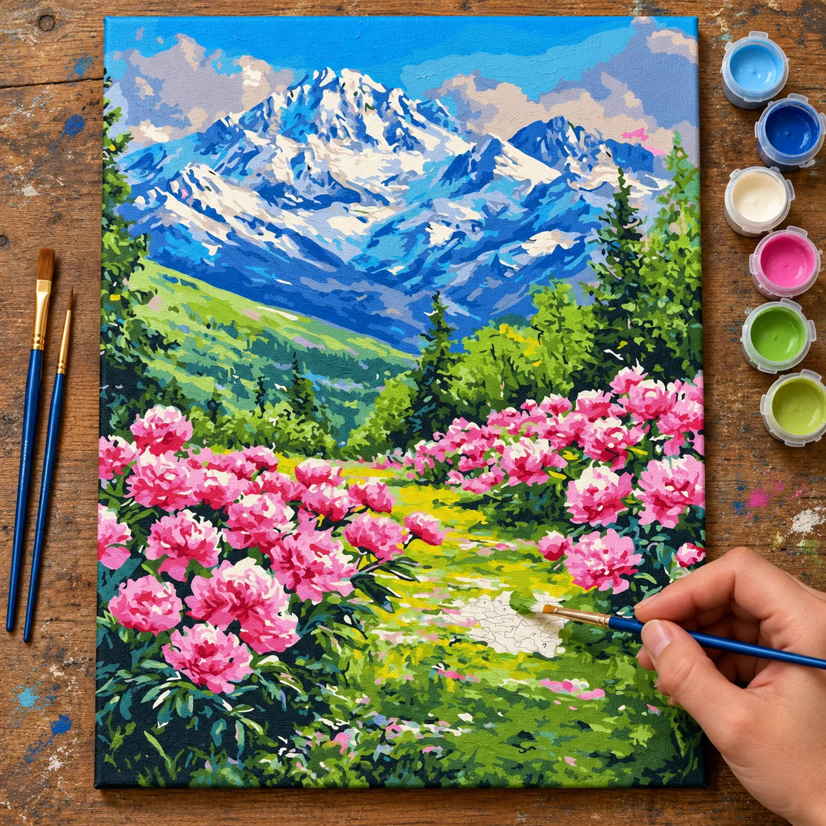Complete Mountain Meadow with Pink Flowers numbered canvas being painted with acrylic paints and brushes