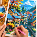 Hands placing diamond drills while working on the Mountain Village Reflections diamond painting.
