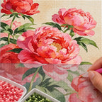 Diamond painting process for Multi Peony Bouquet Diamond Painting Kit, with drills being placed over a lush bouquet of multiple pink and coral peonies with green foliage.